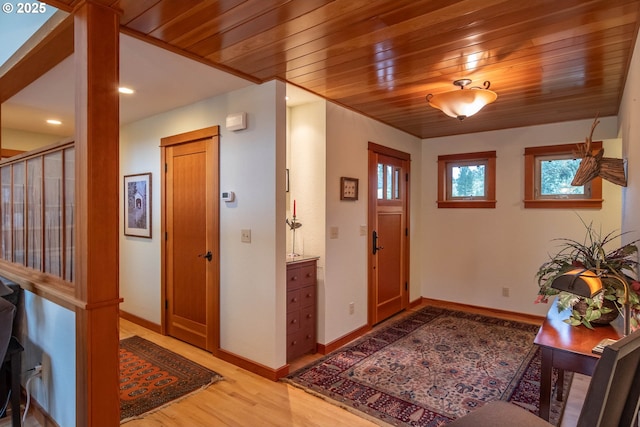 390 Singing Waters Rd, Winchester, OR 97495 - entryway with light wood-style flooring, wood ceiling, baseboards, and recessed lighting