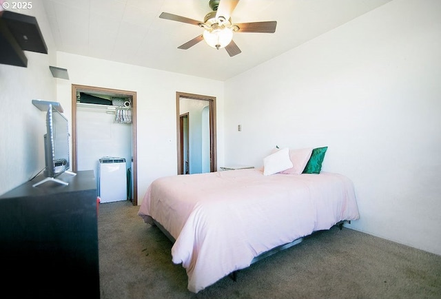 carpeted bedroom featuring a closet and ceiling fan