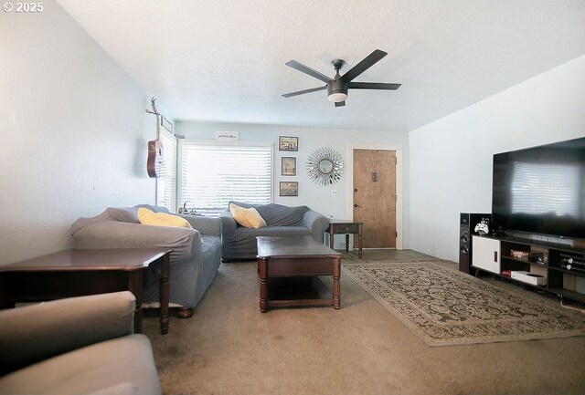 living room featuring carpet and ceiling fan