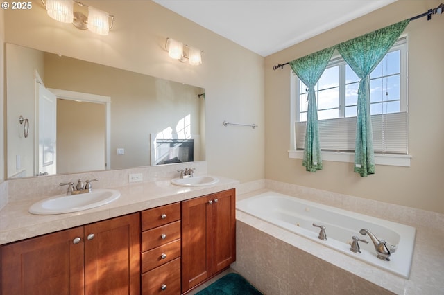 bathroom with vanity and tiled bath