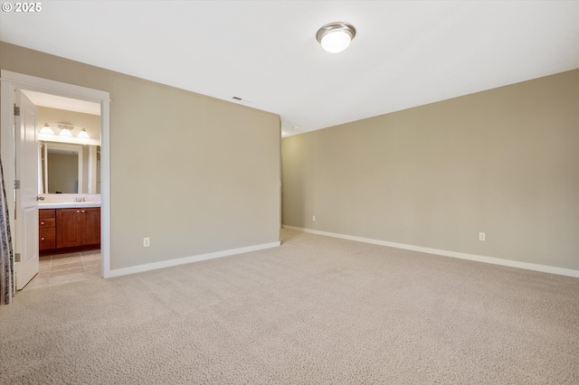 carpeted empty room with sink