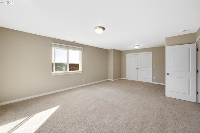 unfurnished bedroom with carpet floors and a closet