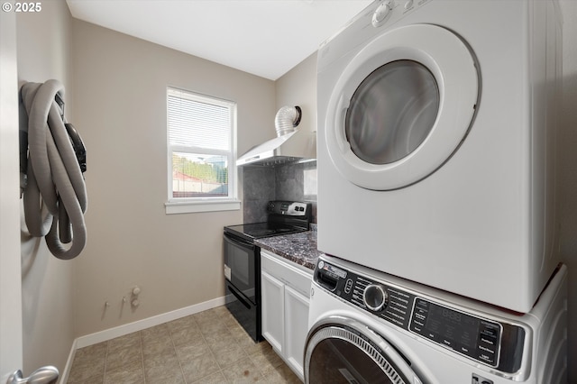 washroom with stacked washer and clothes dryer