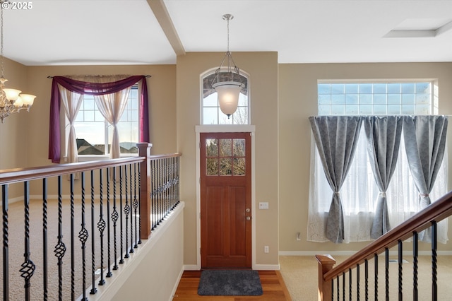 entrance foyer featuring a notable chandelier