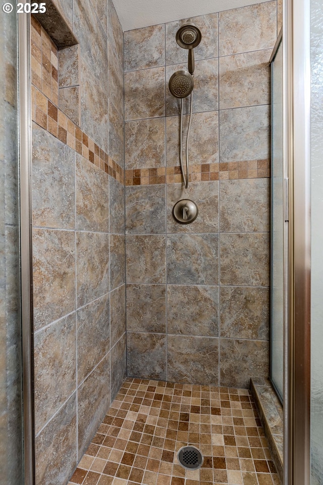 full bath with a shower stall