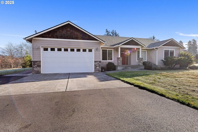 view of front facade with a front yard and a garage