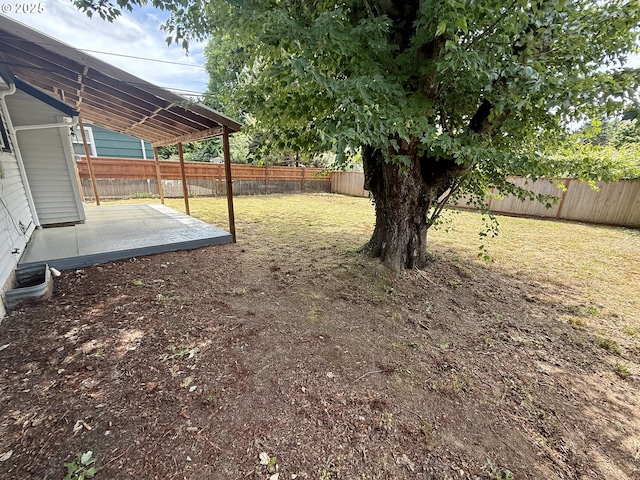 9036 SE Washington St, Portland, OR 97216 - fenced backyard featuring a patio area