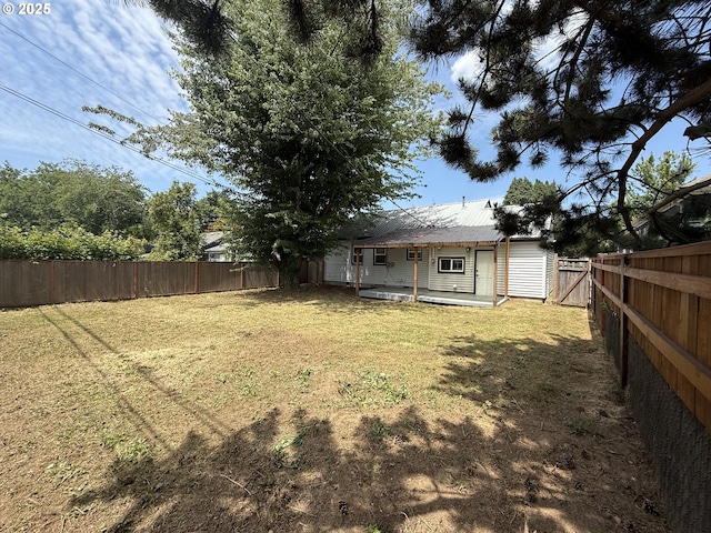 9036 SE Washington St, Portland, OR 97216 - fenced backyard featuring a patio area