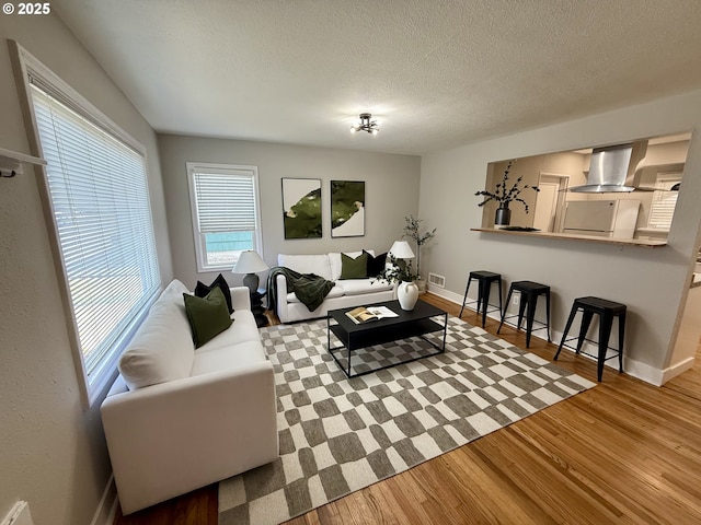 9036 SE Washington St, Portland, OR 97216 - living room with wood finished floors and a textured ceiling