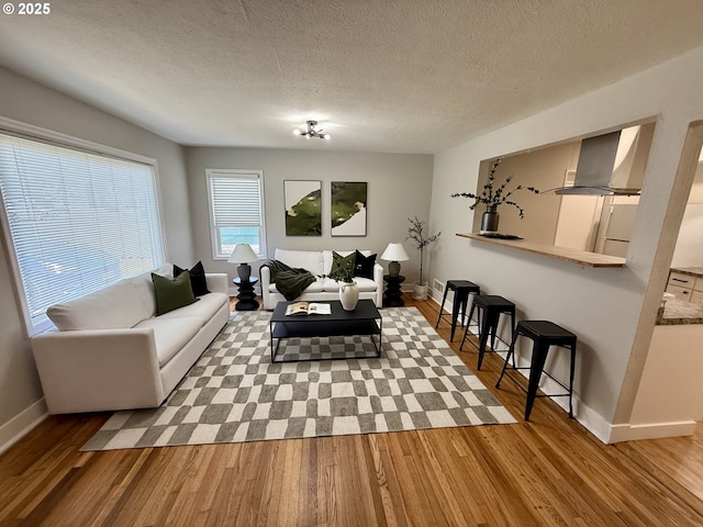 9036 SE Washington St, Portland, OR 97216 - living room featuring wood finished floors and a textured ceiling