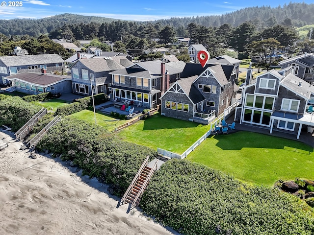 3764 Pacific Ave, Cannon Beach, OR 97110 - aerial view of residential area with a heavily wooded area