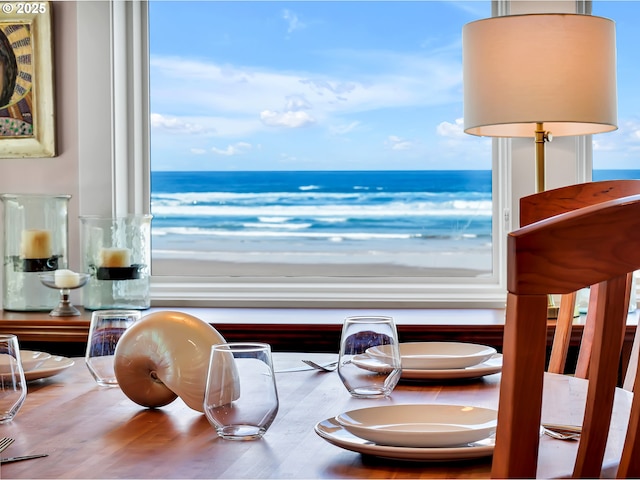 3764 Pacific Ave, Cannon Beach, OR 97110 - dining space featuring a water view and wood finished floors