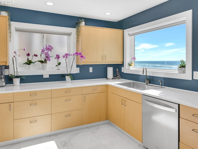 3764 Pacific Ave, Cannon Beach, OR 97110 - kitchen with dishwasher, light brown cabinetry, light countertops, light marble finish flooring, and recessed lighting