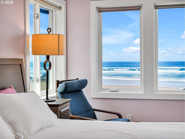 3764 Pacific Ave, Cannon Beach, OR 97110 - bedroom featuring multiple windows and a water view