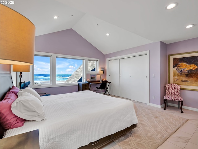 3764 Pacific Ave, Cannon Beach, OR 97110 - bedroom with recessed lighting, vaulted ceiling, light tile patterned floors, and a closet