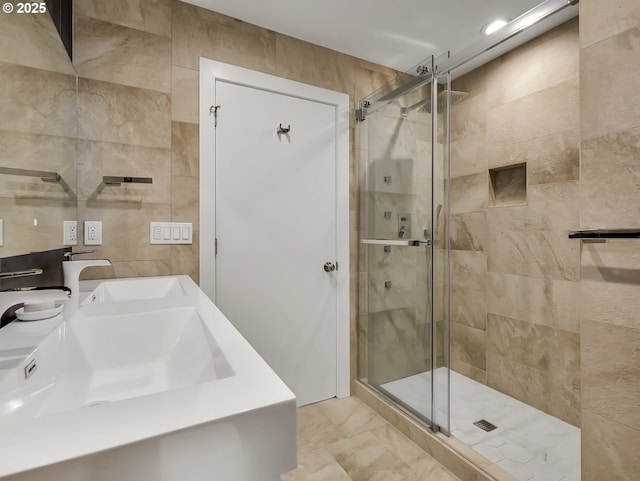3764 Pacific Ave, Cannon Beach, OR 97110 - full bath with a stall shower, tile walls, vanity, and marble finish floors