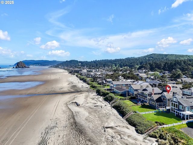 3764 Pacific Ave, Cannon Beach, OR 97110 - aerial view of residential area featuring a large body of water and a heavily wooded area