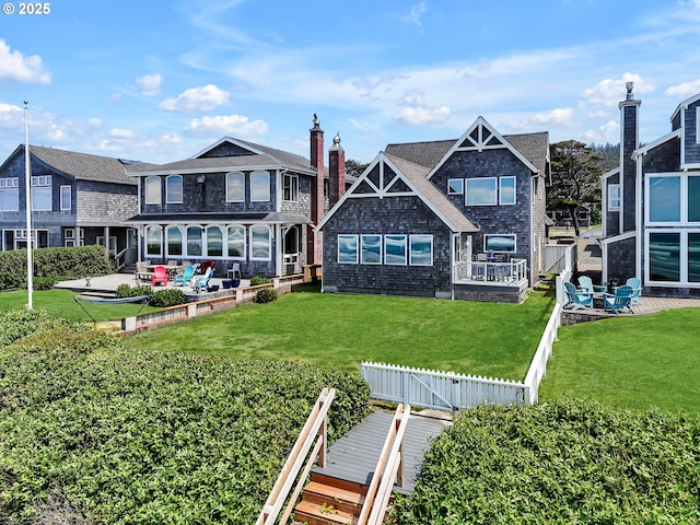 3764 Pacific Ave, Cannon Beach, OR 97110 - back of property with a fenced backyard and a patio area