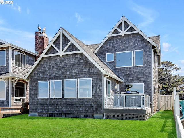 3764 Pacific Ave, Cannon Beach, OR 97110 - back of house with a wooden deck, a chimney, and a shingled roof
