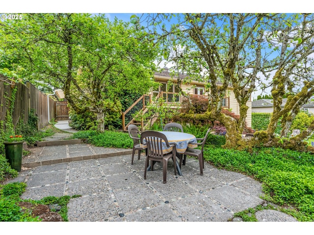 view of patio with fence and outdoor dining area