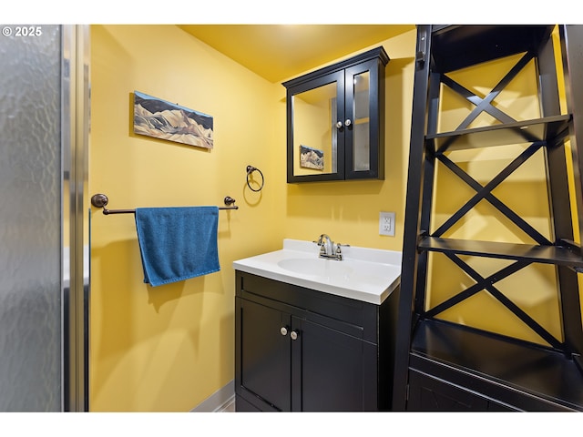 bathroom featuring baseboards and vanity