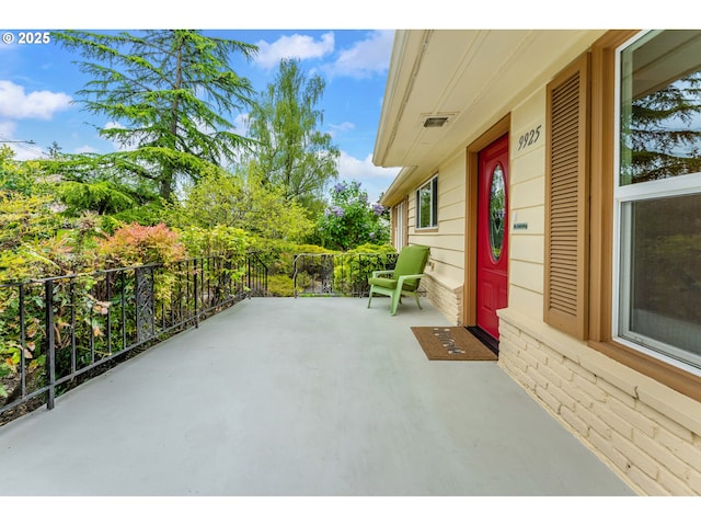 view of patio / terrace with covered porch and visible vents