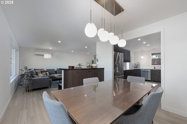 dining room with a wall unit AC