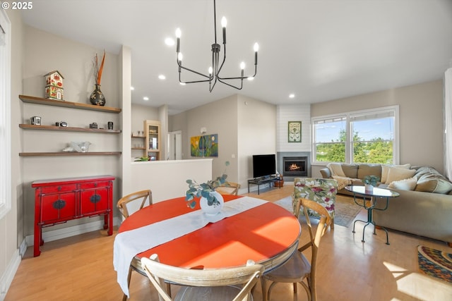 800 Rosemont Rd, West Linn, OR 97068 - dining area with a chandelier, wood finished floors, a fireplace, and recessed lighting