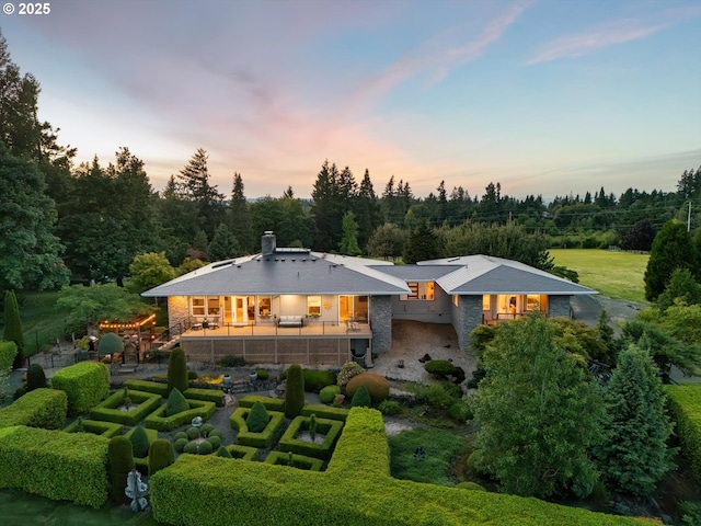 800 Rosemont Rd, West Linn, OR 97068 - back of house at dusk with stone siding and a chimney