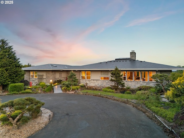 800 Rosemont Rd, West Linn, OR 97068 - view of front of house with stone siding, curved driveway, and a chimney
