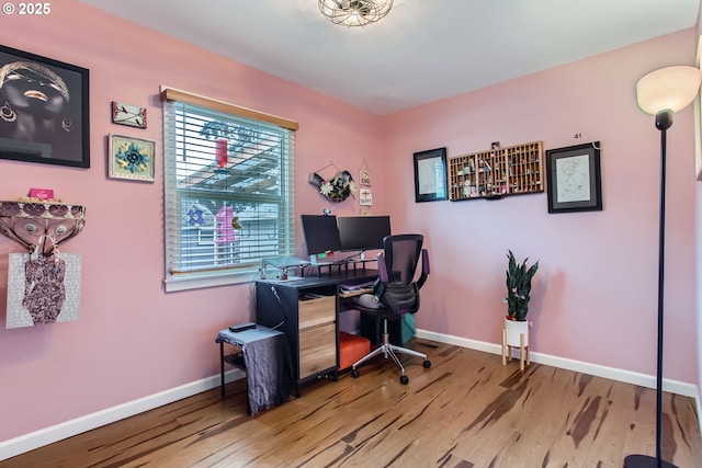 office area featuring wood finished floors and baseboards