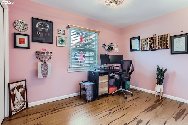 home office with wood finished floors and baseboards