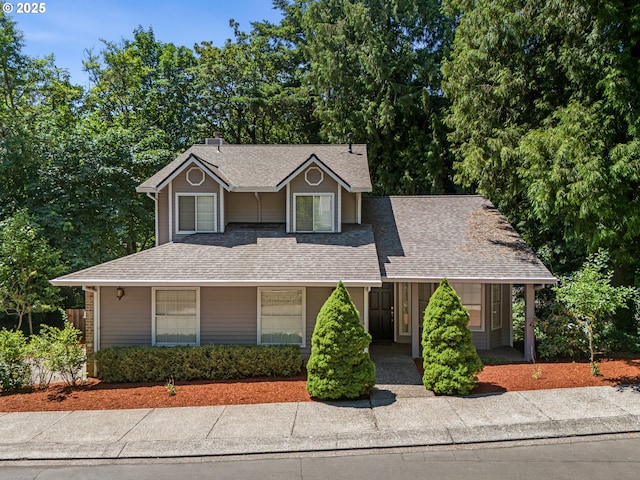 14300 Sherbrook Pl, Lake Oswego, OR 97035 - view of front facade with a chimney, a shingled roof, and a porch