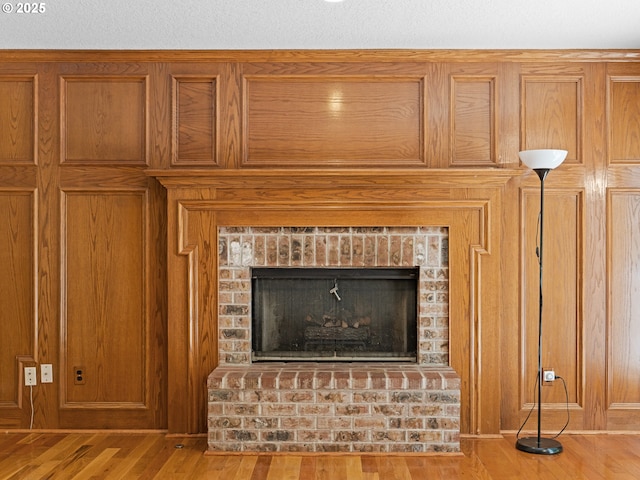 14300 Sherbrook Pl, Lake Oswego, OR 97035 - detailed view of wood finished floors, wood walls, and a brick fireplace