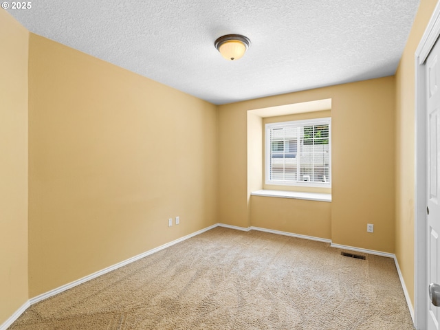 14300 Sherbrook Pl, Lake Oswego, OR 97035 - carpeted empty room with a textured ceiling and baseboards