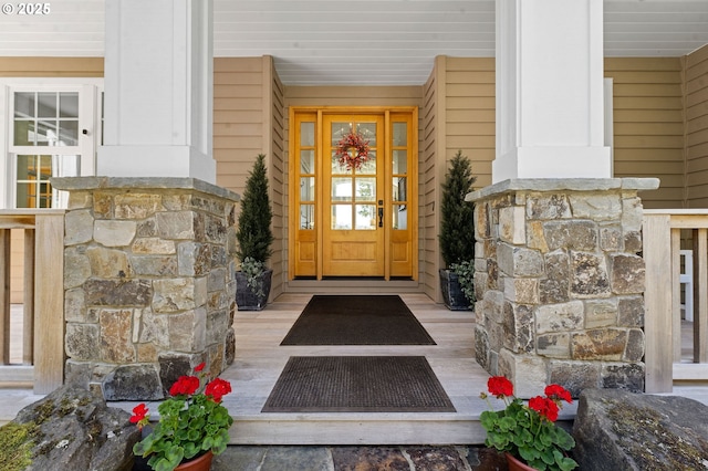 33525 Beerman Creek Ln, Seaside, OR 97138 - doorway to property with stone siding and a porch