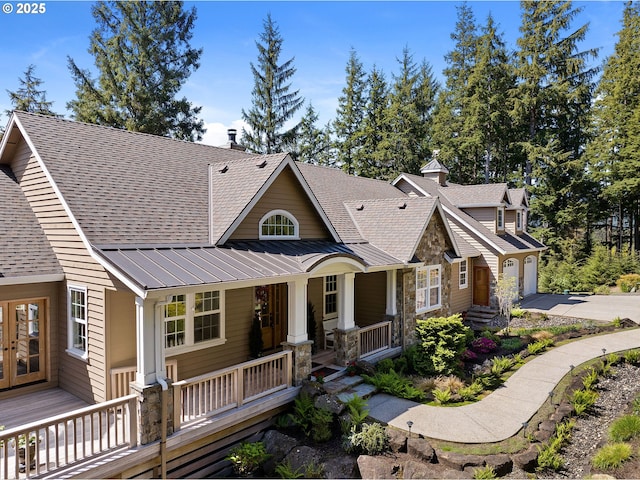 33525 Beerman Creek Ln, Seaside, OR 97138 - craftsman house featuring covered porch, a standing seam roof, a shingled roof, and driveway