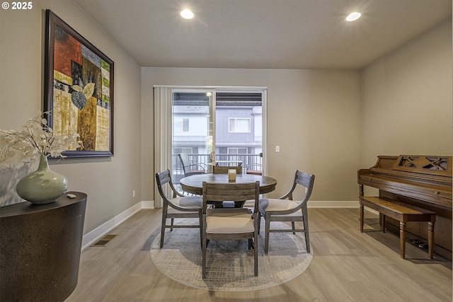 dining area featuring recessed lighting, baseboards, visible vents, and light wood finished floors