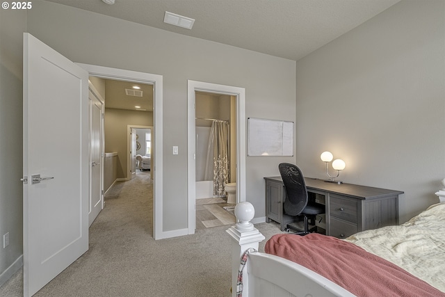 bedroom featuring baseboards, ensuite bathroom, carpet, and visible vents