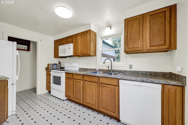 2674 Kincaid St, Eugene, OR 97405 - kitchen with white appliances, a sink, brown cabinetry, and dark countertops