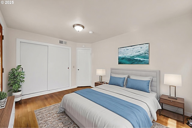 2674 Kincaid St, Eugene, OR 97405 - bedroom featuring wood finished floors, a closet, and baseboards