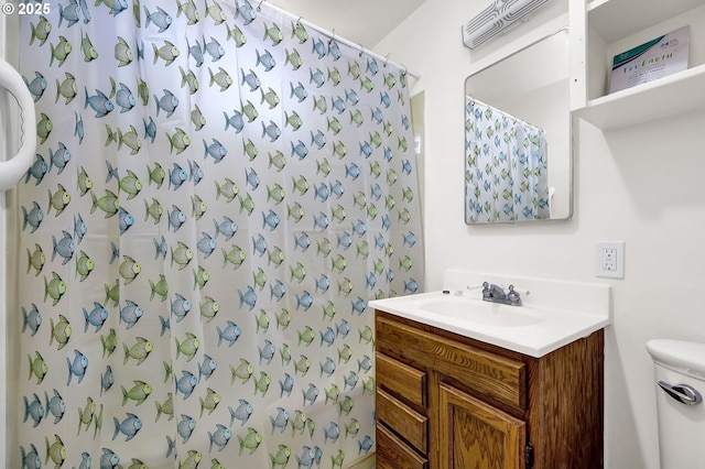 2674 Kincaid St, Eugene, OR 97405 - full bath featuring vanity, toilet, and a shower with shower curtain