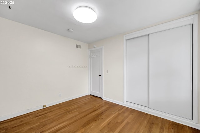 2674 Kincaid St, Eugene, OR 97405 - unfurnished bedroom with light wood finished floors, a closet, and baseboards