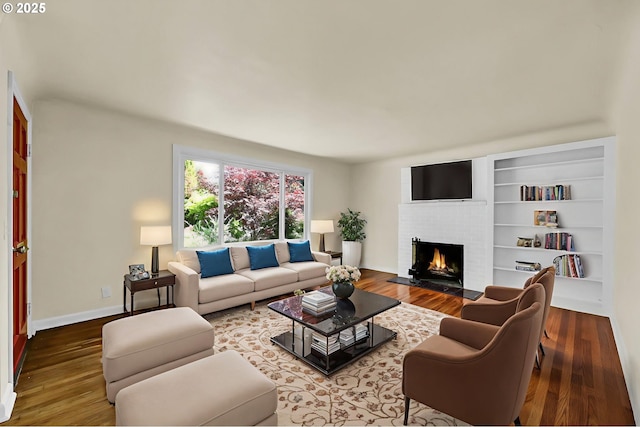 2674 Kincaid St, Eugene, OR 97405 - living area with a fireplace, wood finished floors, and baseboards
