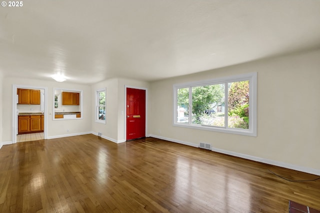 2674 Kincaid St, Eugene, OR 97405 - unfurnished living room with dark wood-type flooring and baseboards