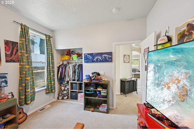 302 NW Elderberry Ln, Dallas, OR 97338 - carpeted bedroom featuring baseboards and a closet