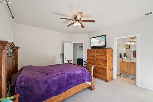 302 NW Elderberry Ln, Dallas, OR 97338 - bedroom with light colored carpet, ensuite bath, and a ceiling fan
