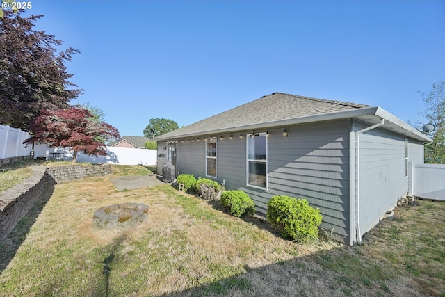 302 NW Elderberry Ln, Dallas, OR 97338 - rear view of property with a fenced backyard and roof with shingles