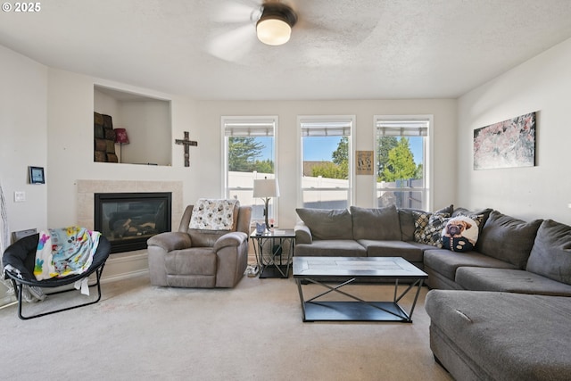 302 NW Elderberry Ln, Dallas, OR 97338 - carpeted living area featuring plenty of natural light, a fireplace, and a ceiling fan