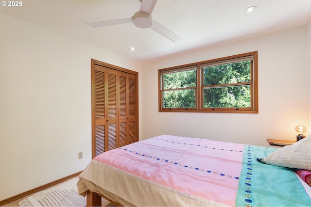 bedroom featuring a closet, recessed lighting, baseboards, ceiling fan, and carpet flooring